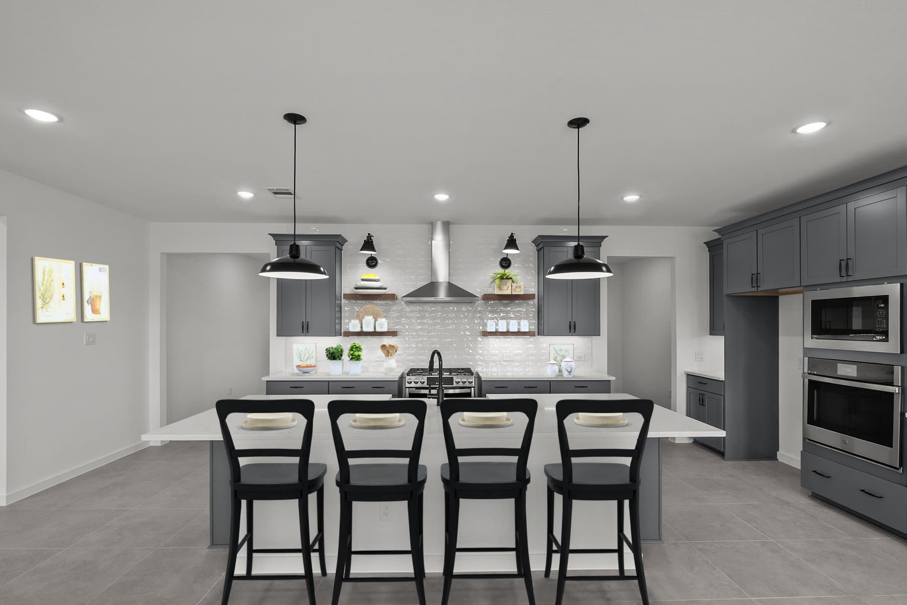 Kitchen with vast island & pendant lights