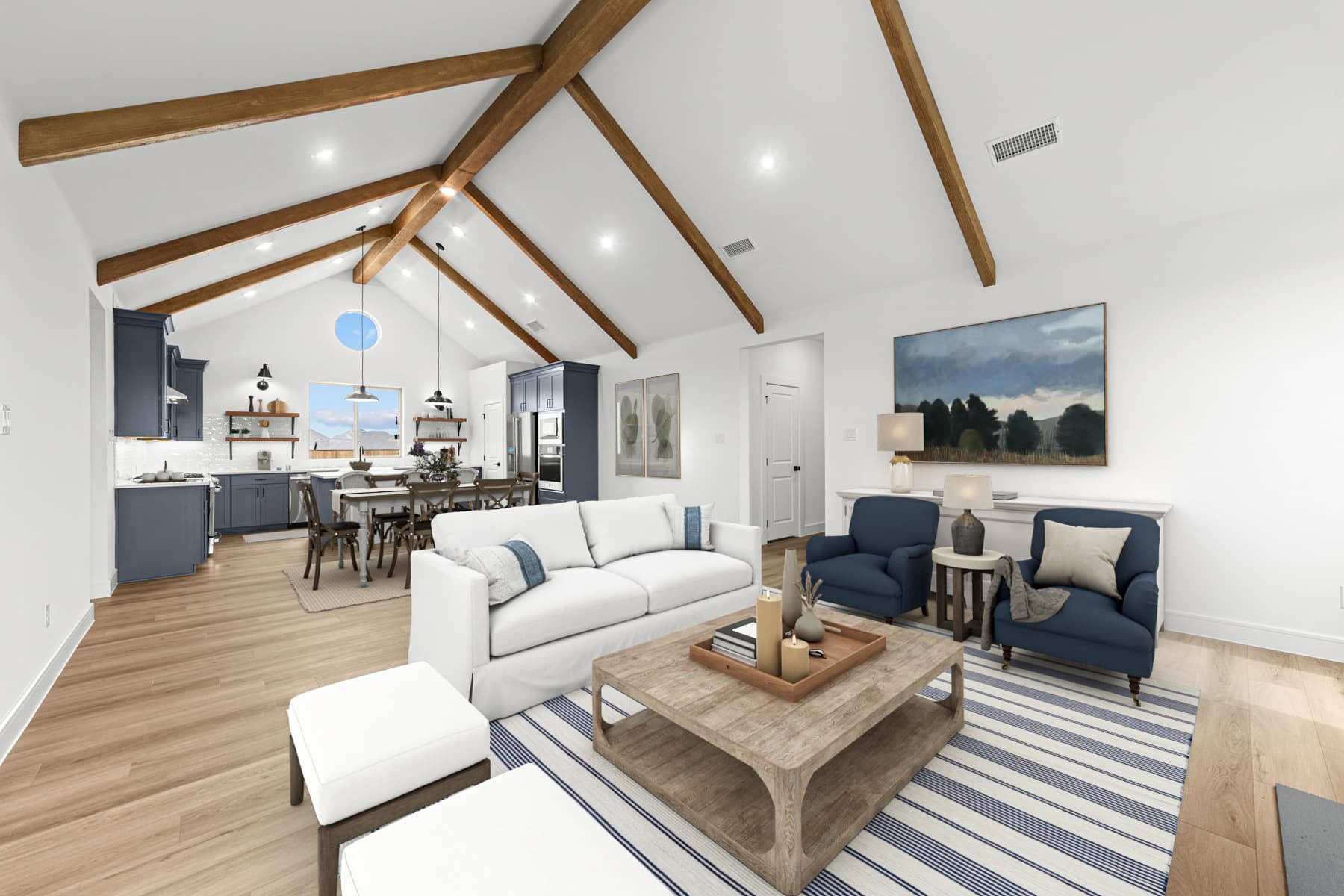 Great room with soaring vaulted ceiling & stained ceiling beams