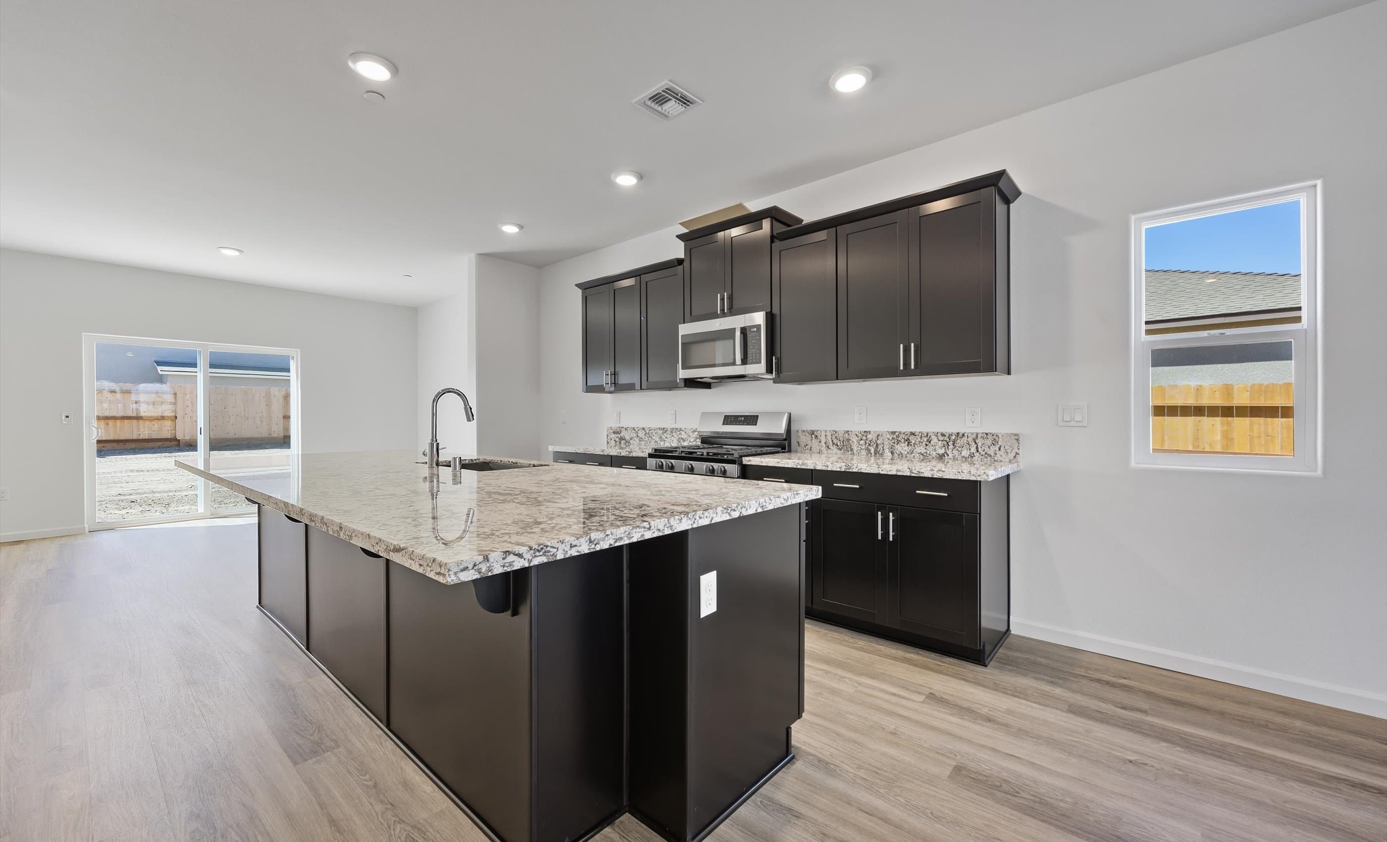 Kitchen with deep-stained cabinetry