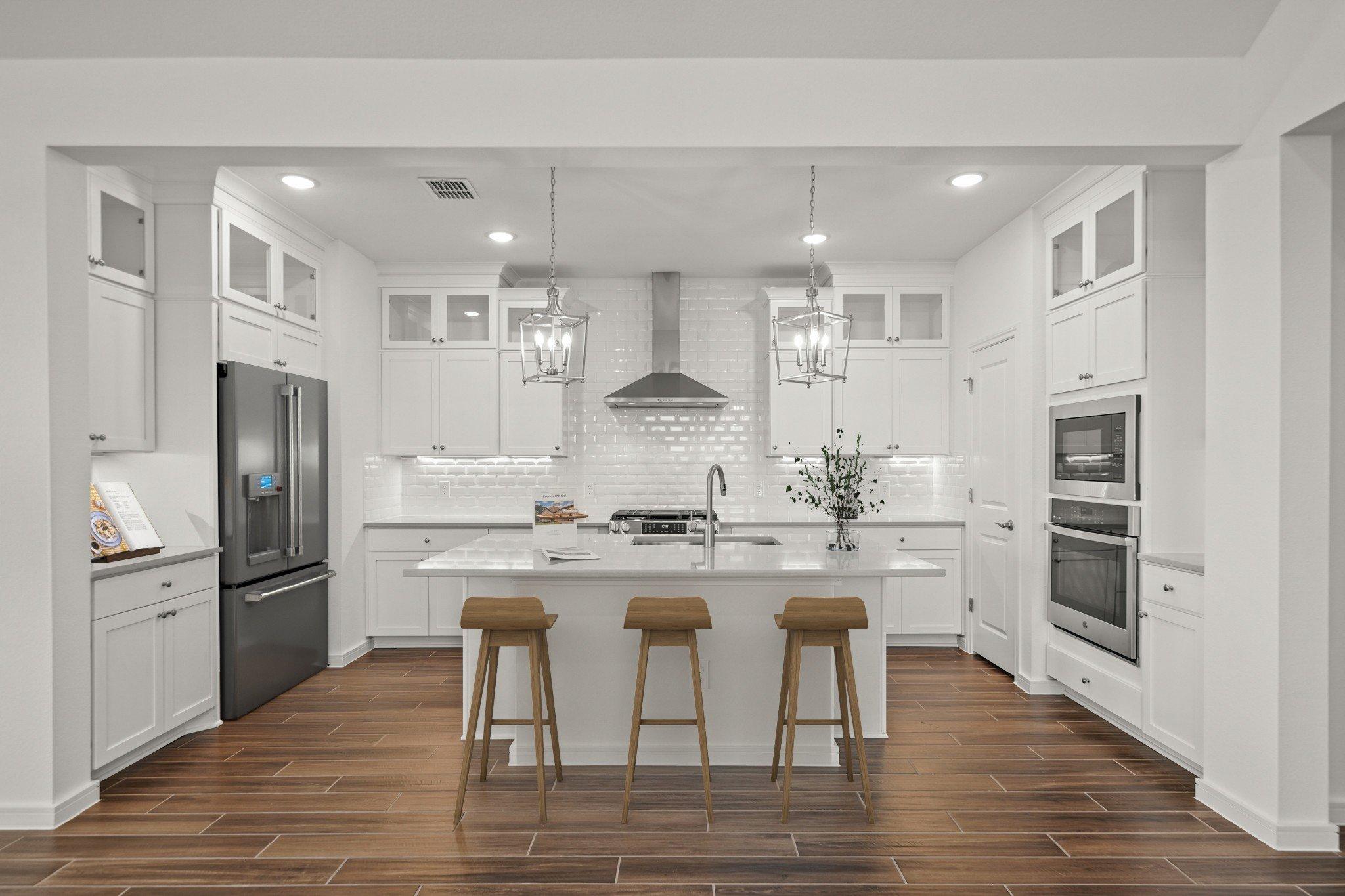 Kitchen with pendant lights & vast island
