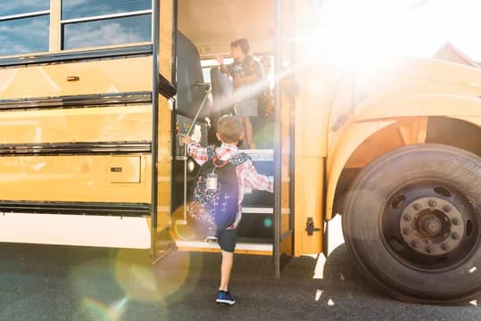 Boy Boarding the School Bus