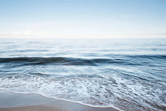 Banner Tide Rolling in on Shore with Horizon