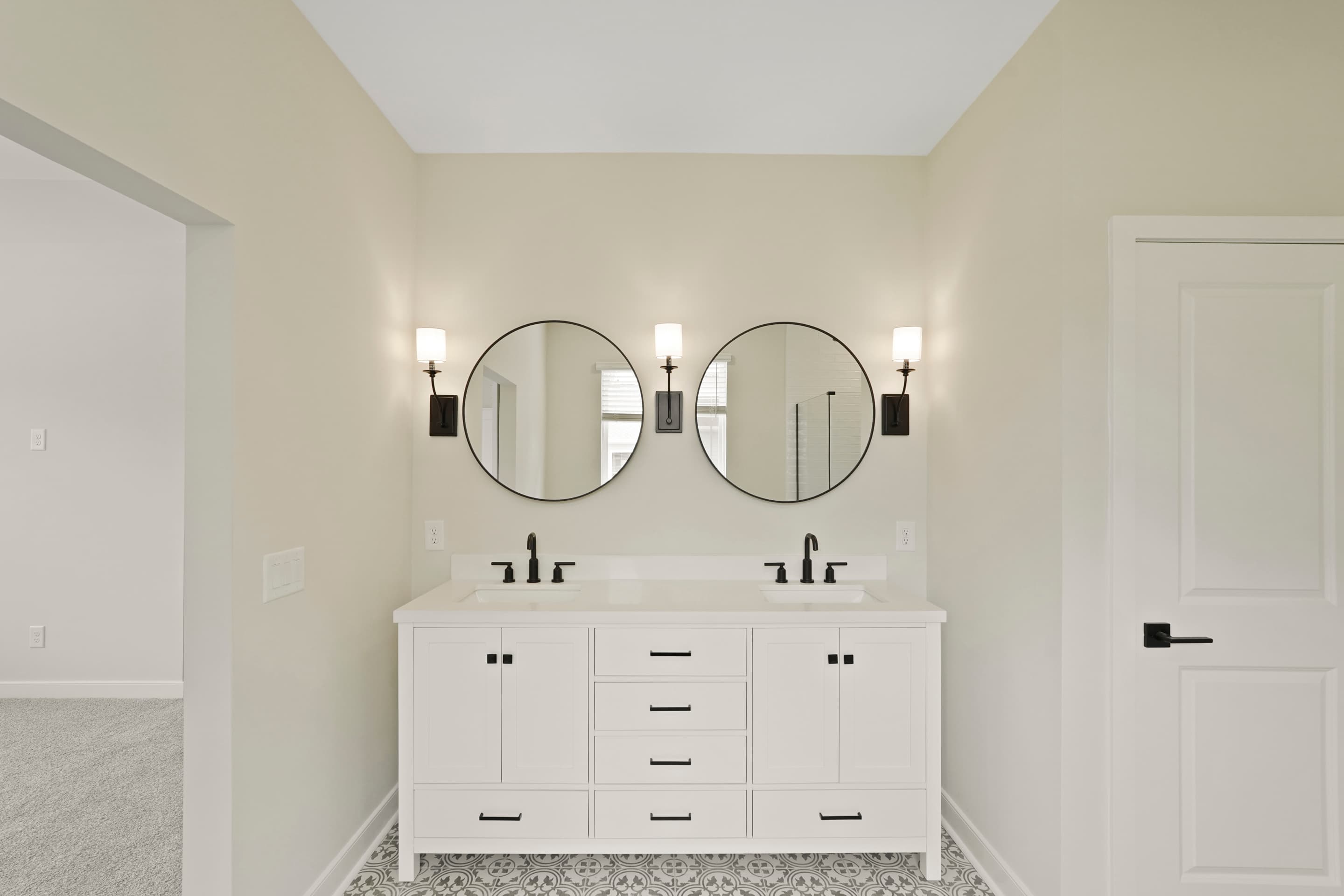 Primary bath featuring freestanding vanity with dual sinks
