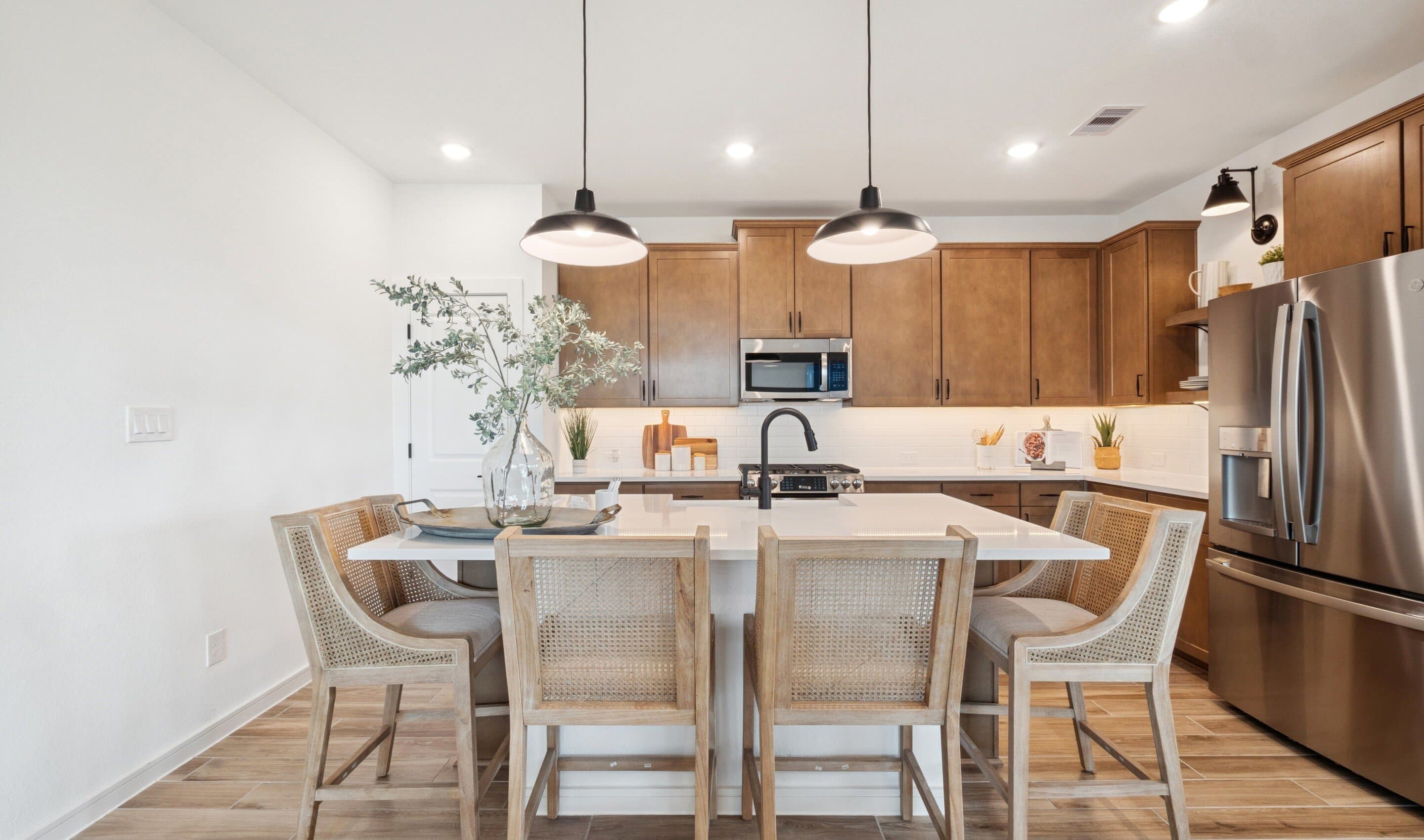 Kitchen with vast island & pendant lights