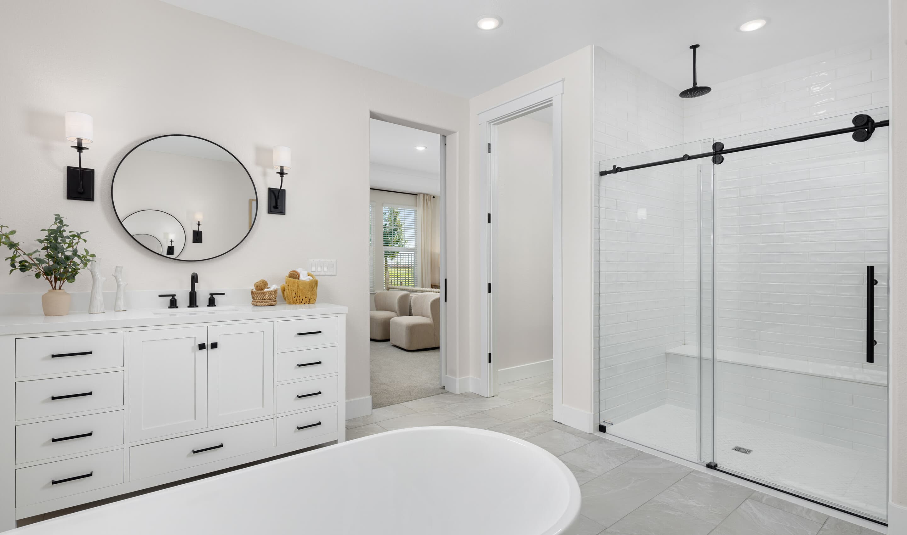 Primary bath with glass shower enclosure and freestanding tub