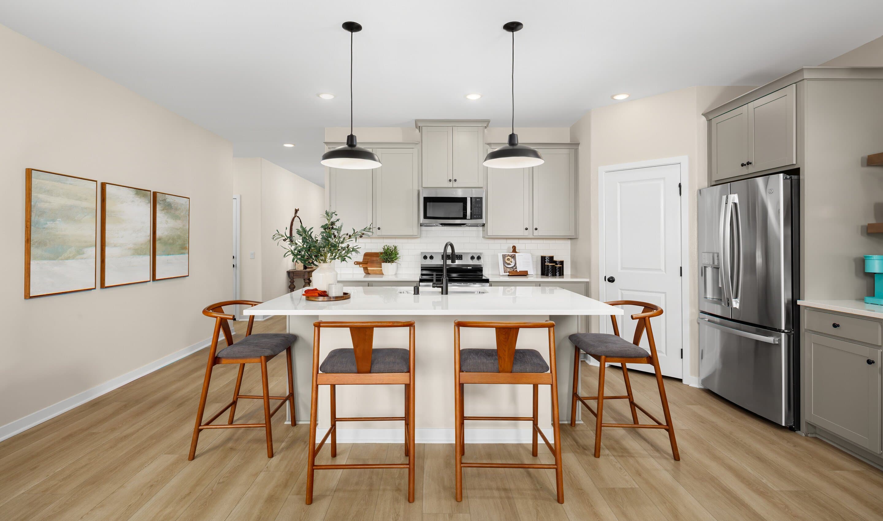 Kitchen with pendant lighting and luxurious wood flooring