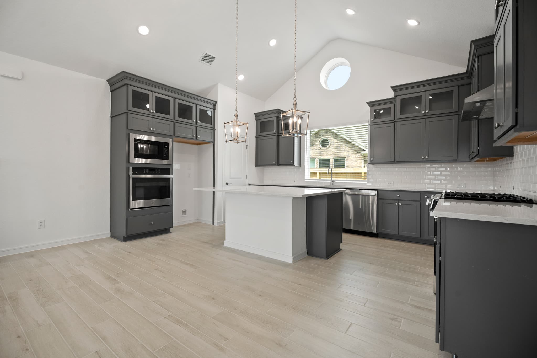 Kitchen with soaring vaulted ceiling