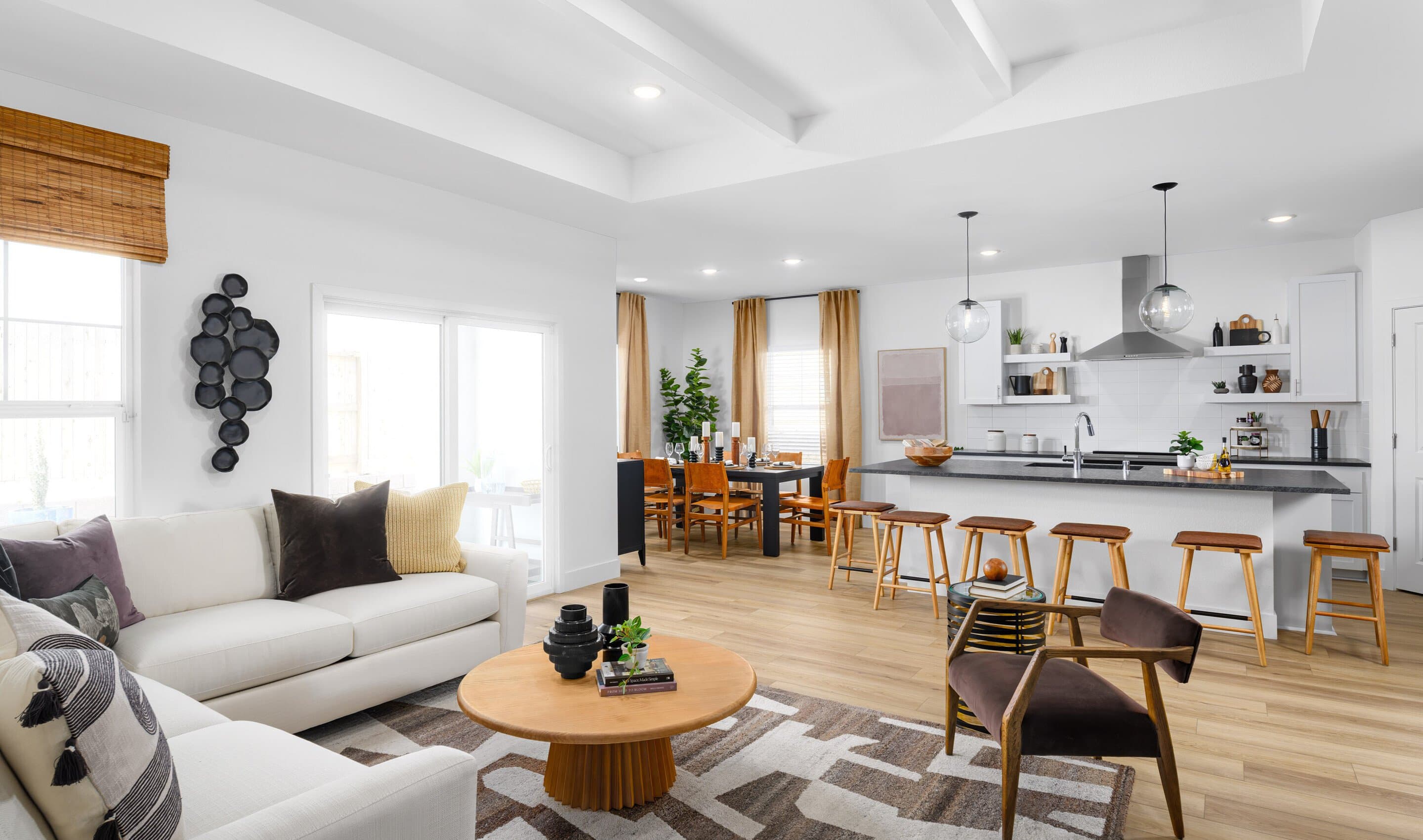 Great room with coffered ceiling and white painted ceiling beams