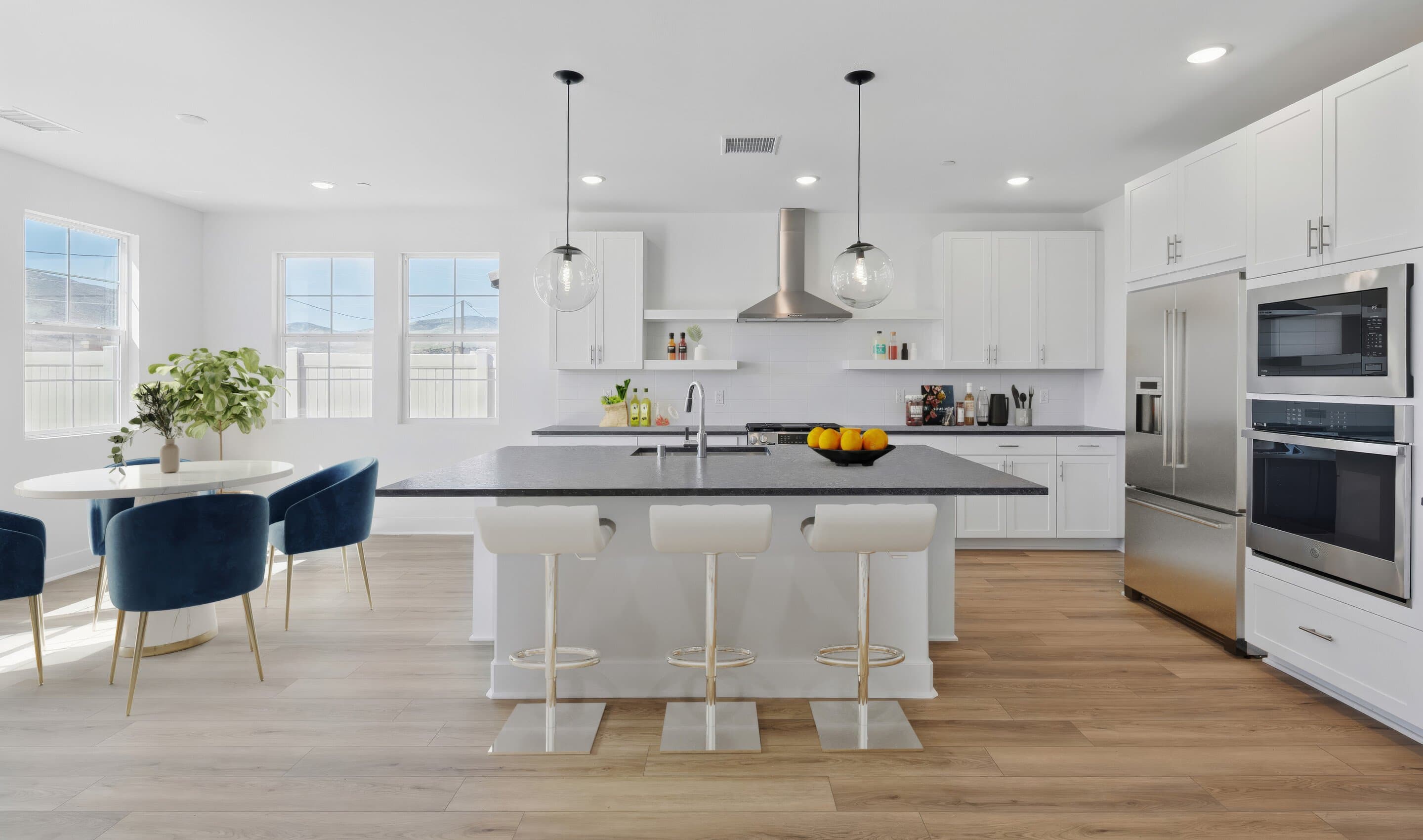 Kitchen with floating shelves and pendant lights