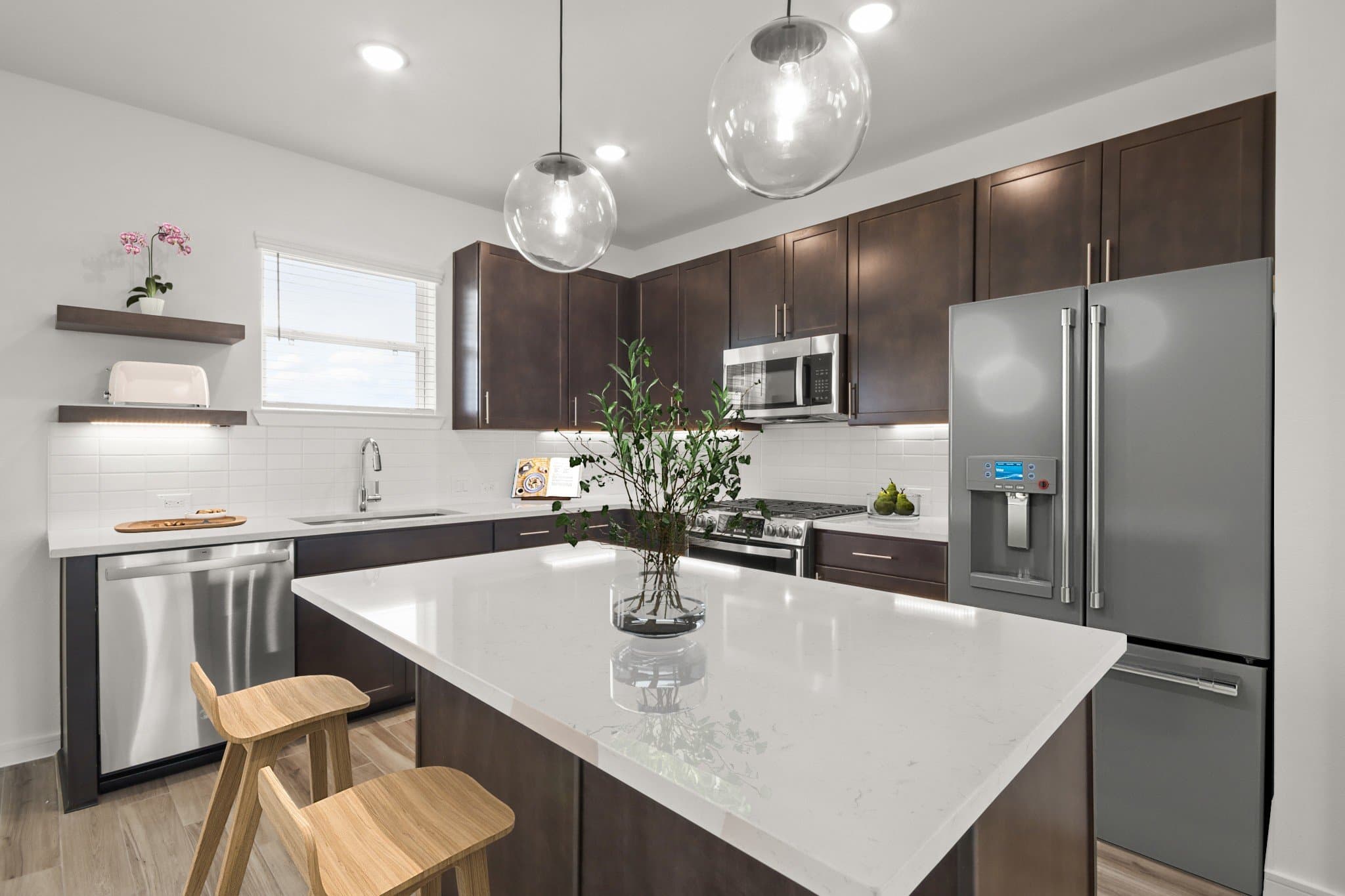 Kitchen with vast island & pendant lights