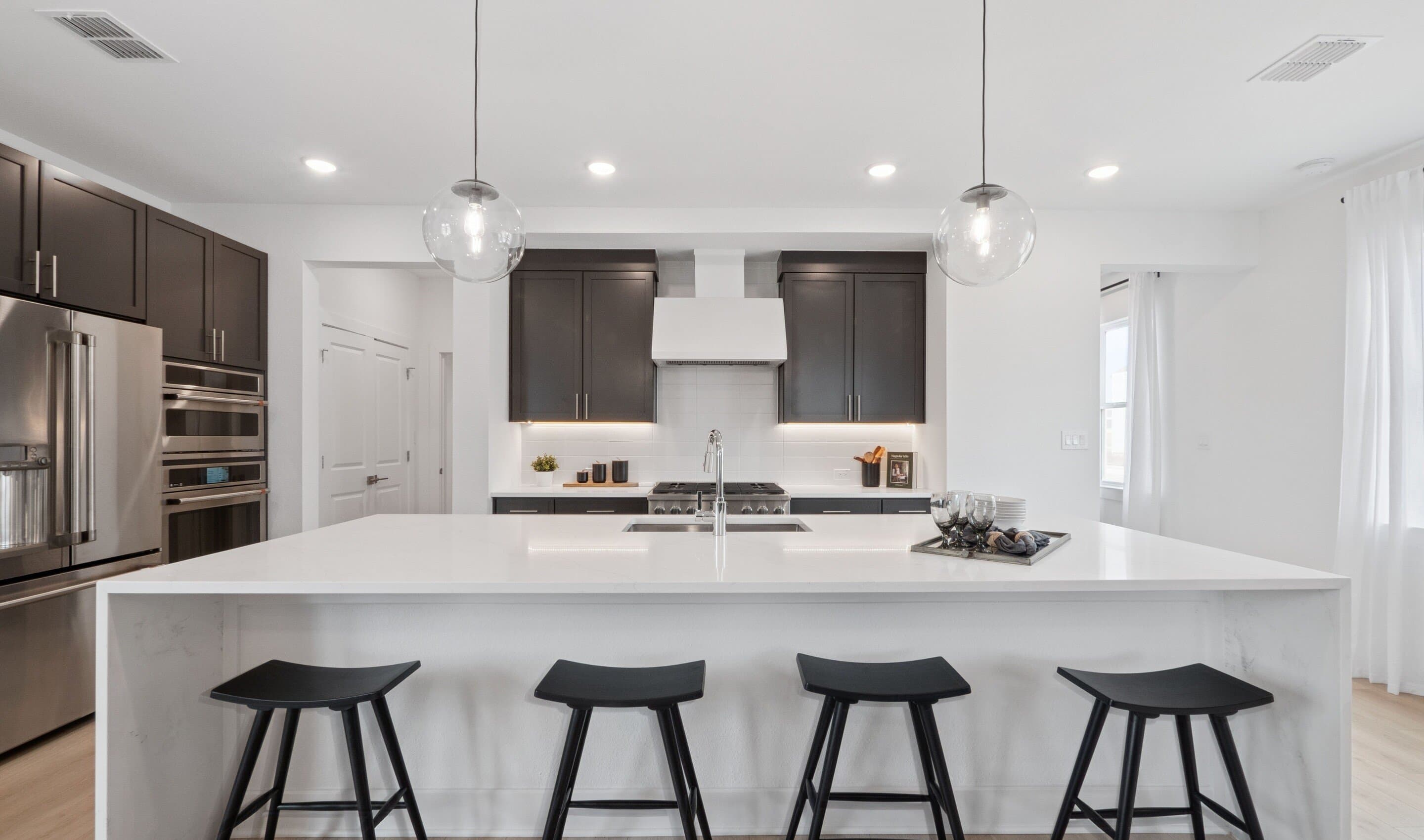 Kitchen with waterfall-edge central island